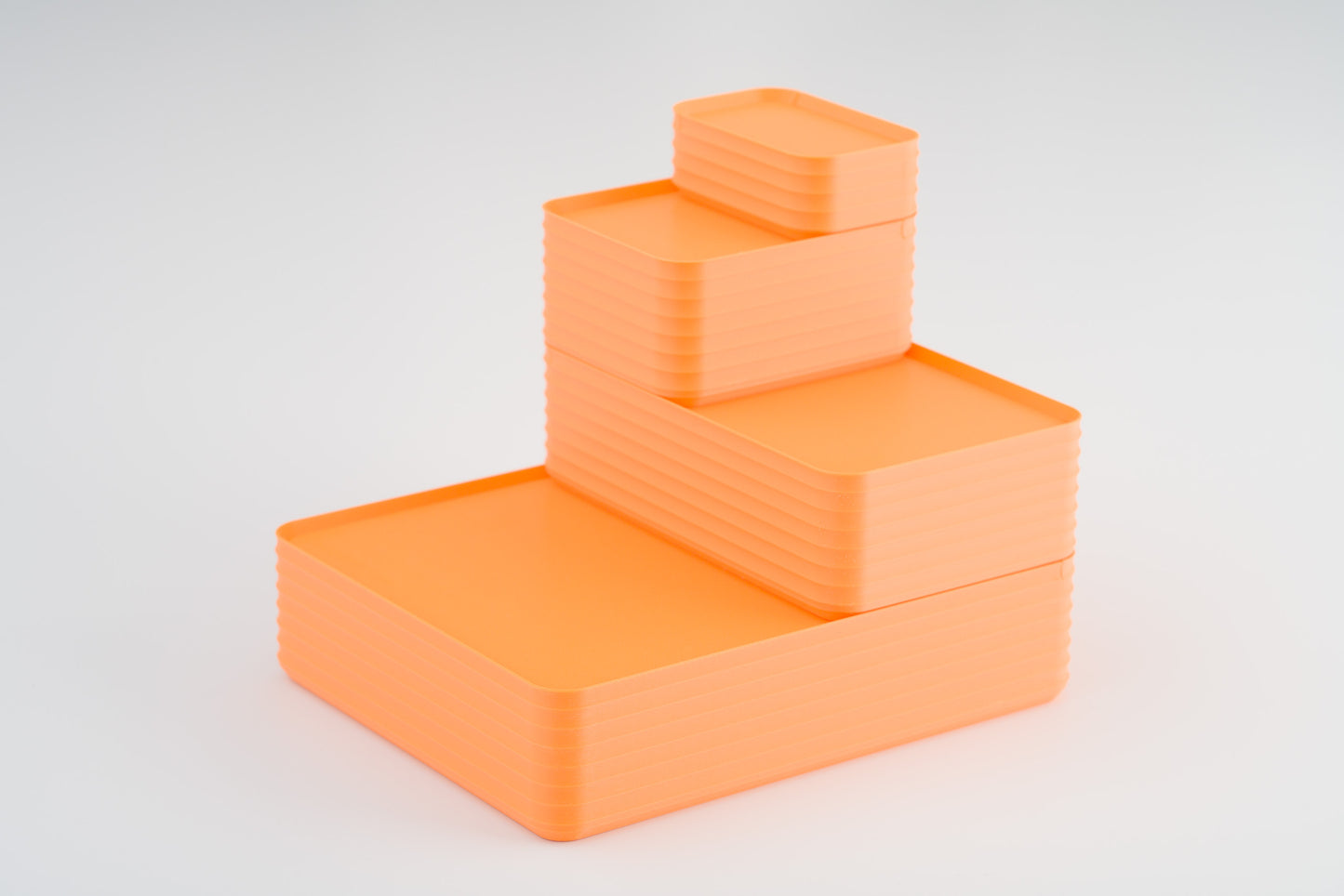 Z Co Projects Rib Series box matte sunrise orange set of four mini, small, original, and double-wide displayed on a white background.