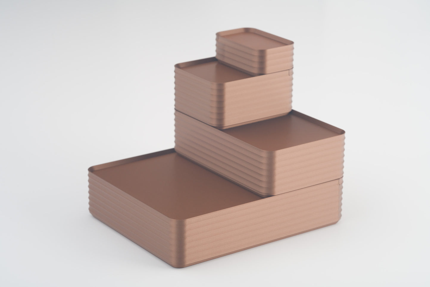 Z Co Projects Rib Series box metallic copper brown set of four mini, small, original, and double-wide displayed on a white background.