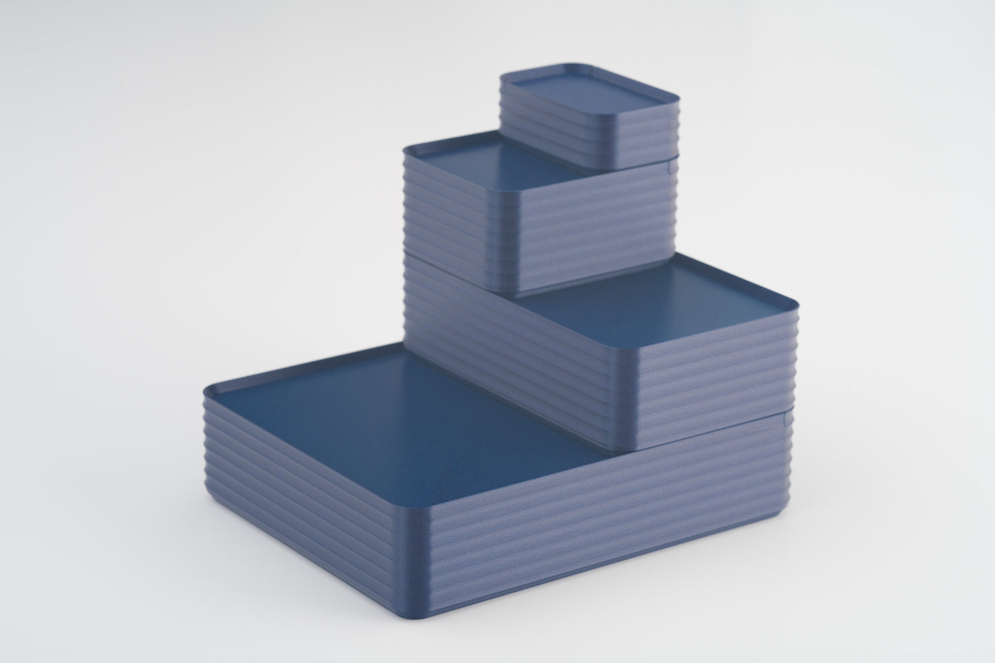 Z Co Projects Rib Series box metallic deep blue set of four mini, small, original, and double-wide displayed on a white background.