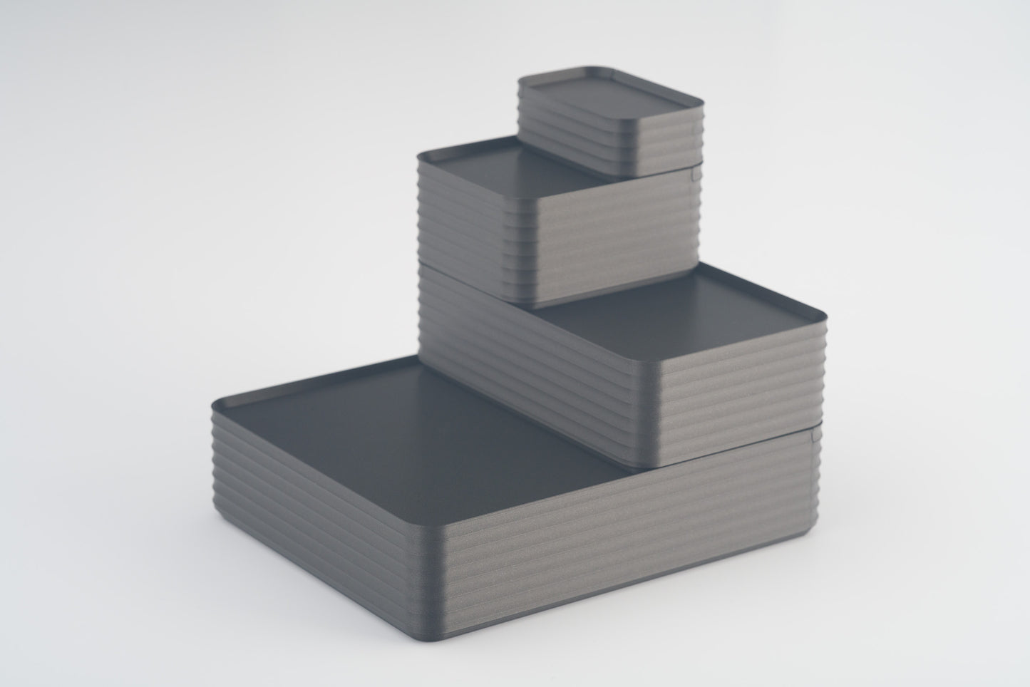 Z Co Projects Rib Series box metallic iron gray set of four mini, small, original, and double-wide displayed on a white background.
