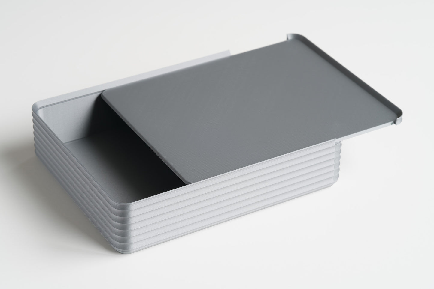 Z Co Rib Series double-wide silver box on white background with the sliding lid partially open, revealing the interior.