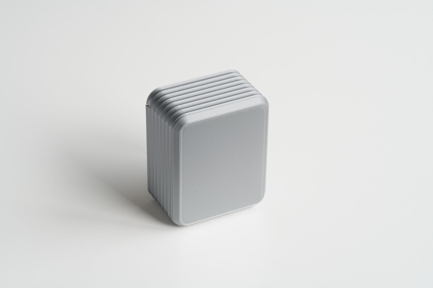 Small Silver Z Co ribbed box standing upright on a white background, showing the full bottom view.