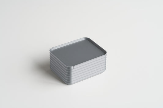 Small Silver Z Co ribbed box shown closed on a white background, highlighting its sleek and modern design.
