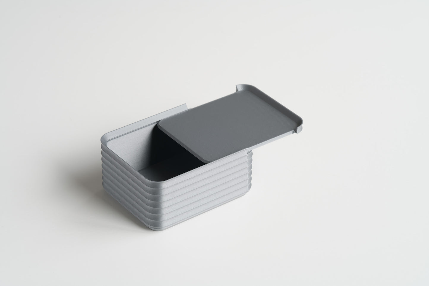 Small Silver Z Co ribbed box shown open on a white background, displaying its sliding lid and spacious interior.