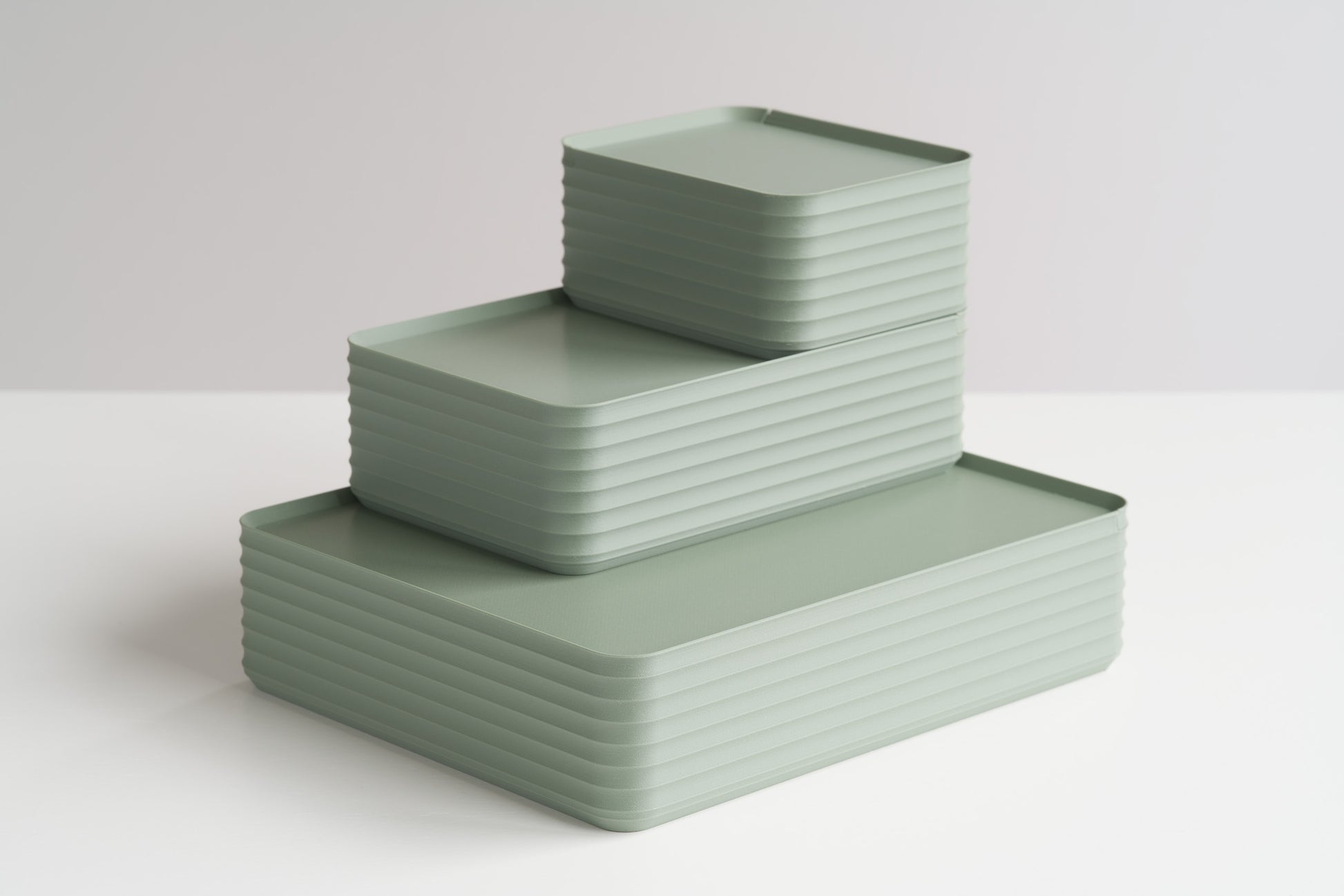 Three Z Co Rib Series Boxes in muted green arranged in a stepped formation on a white surface. Includes small, original, and double-wide sizes, highlighting modern ribbed storage design.