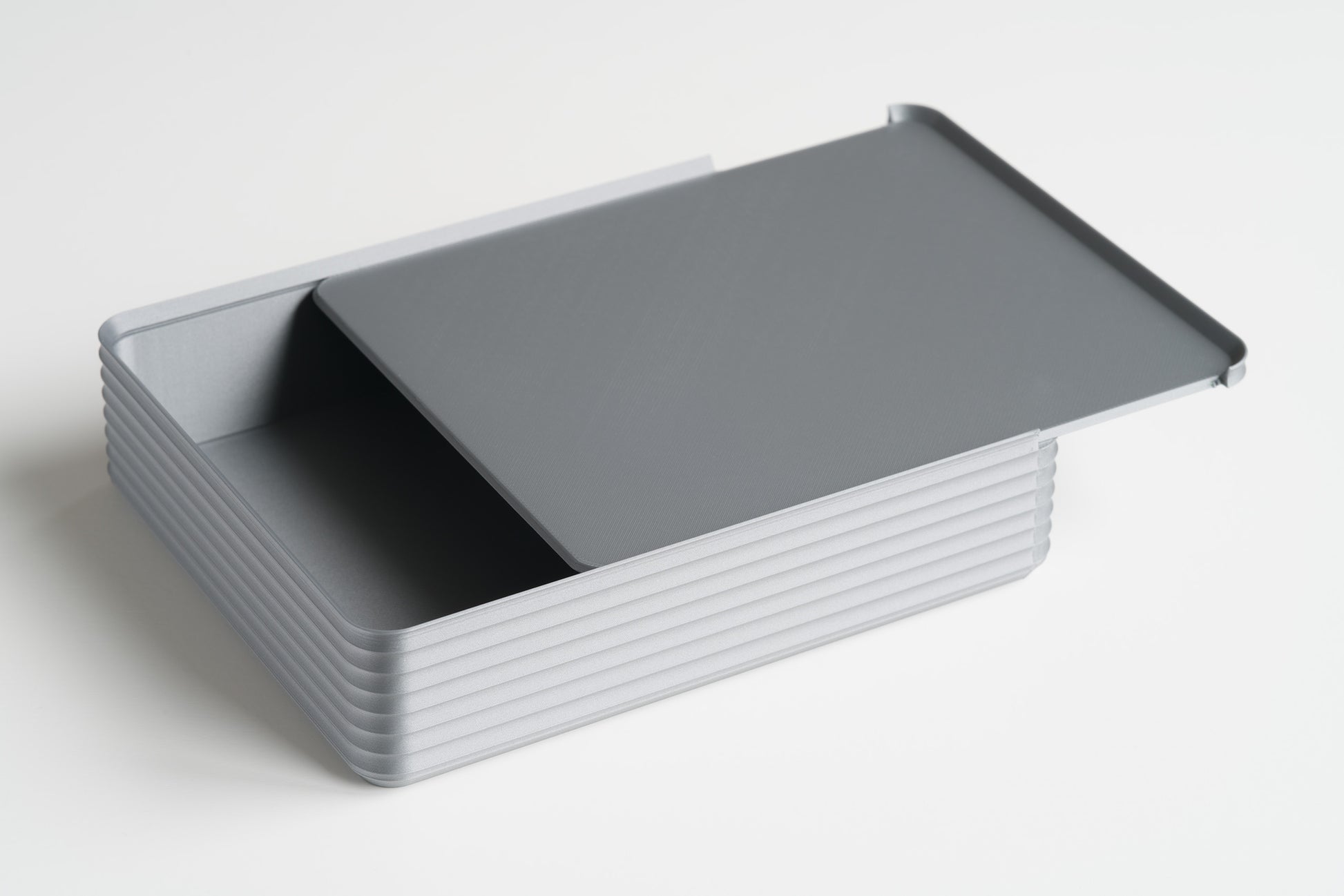 Z Co Rib Series double-wide silver box on white background with the sliding lid partially open, revealing the interior.