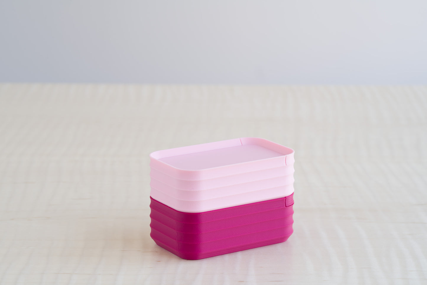 Two stacked Z Co Rib Series mini boxes in matte light pink and fuchsia, highlighting a soft and vibrant color pairing ideal for keepsake or gift uses.