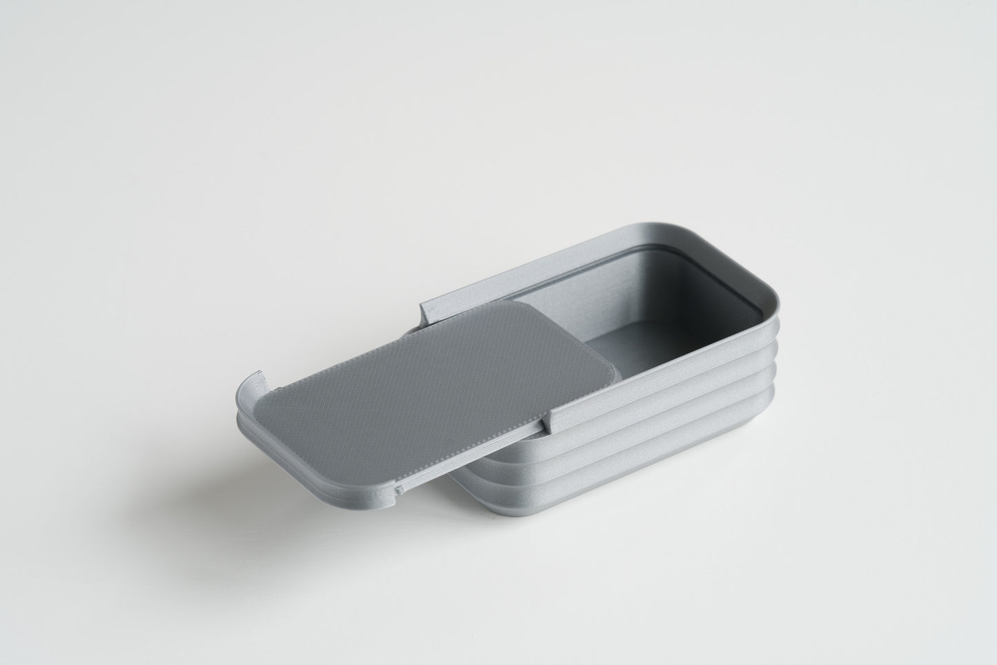 Silver rectangular mini box with sliding lid open, by Z Co