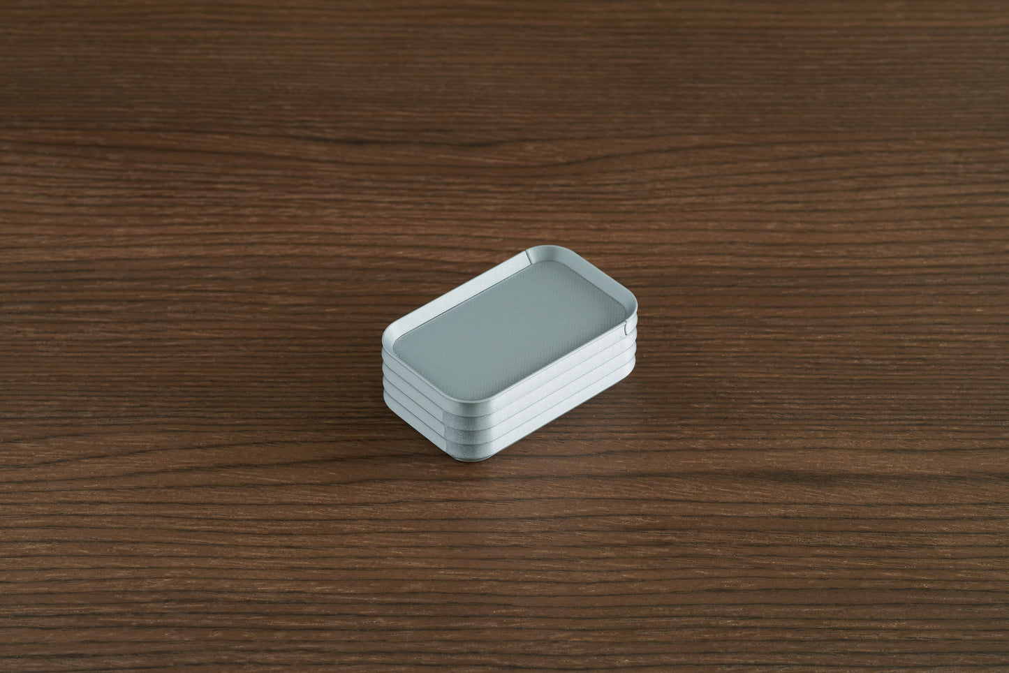 Silver Z Co mini box on walnut surface